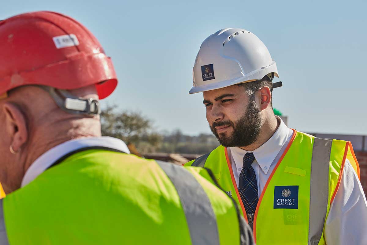 Crest Nicholson staff with hard hat and high vis